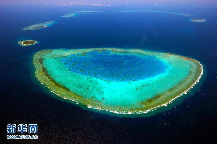 Above, the image shows the scenery of the Xisha Islands. The 45 islets that make up this beautiful Chinese archipelago are distributed over an area 250 kilometers long by 150 kilometers wide. A photo album 'The Xisha Islands' by Xinhua senior reporter Zha Chunming has been published by China Photography Press.[Photo: Xinhua/ Zha Chunming] 