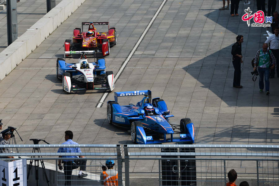 The FIA Formula E Championship, which is also referred to as the electric version of the Formula One (F1) race, holds its inaugural ePrix in Beijing on Saturday, Sept. 13, 2014. The annual Formula E Championship will feature 10 ePrix. The next race will be held in Malaysia in middle November of this year. [Photo by Chen Boyuan / China.org.cn]