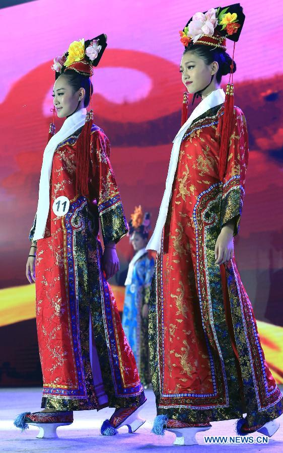 Contestants attend the evening dress session of the 9th Miss China Pageant final in Zhangbei county, north China's Hebei Province, Sept. 13, 2014.