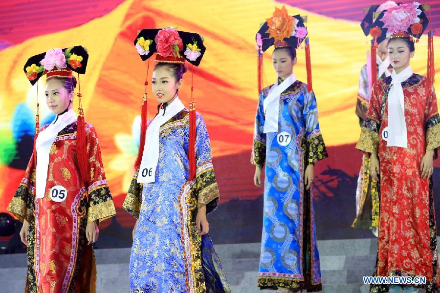 Contestants attend the evening dress session of the 9th Miss China Pageant final in Zhangbei county, north China's Hebei Province, Sept. 13, 2014.