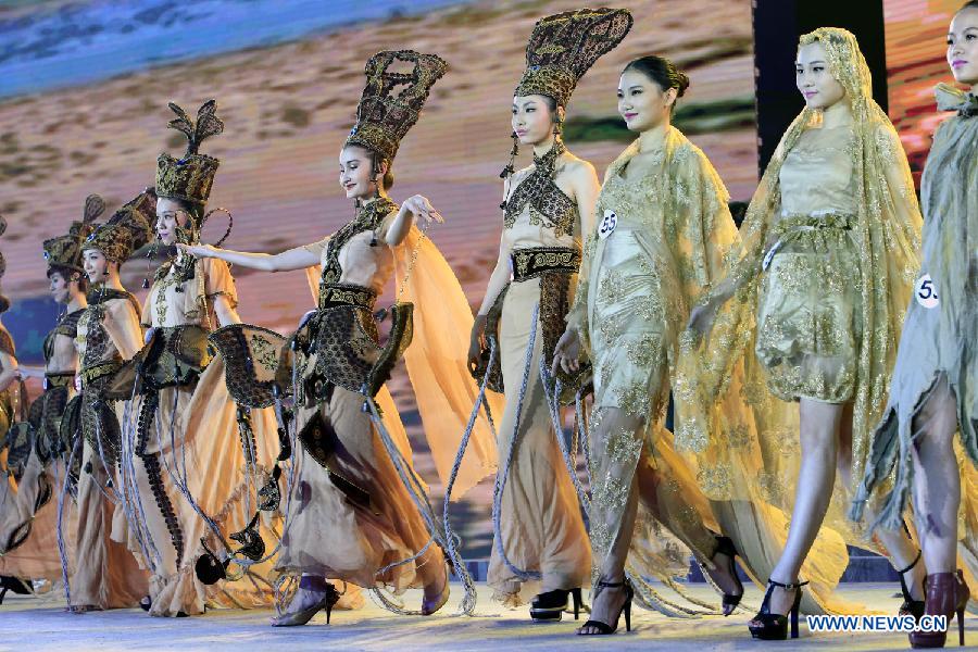 Contestants attend the evening dress session of the 9th Miss China Pageant final in Zhangbei county, north China's Hebei Province, Sept. 13, 2014.