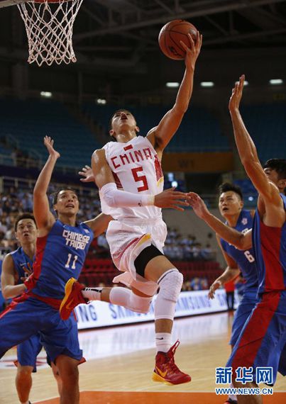 Wen-Ting Tseng of Chinese Taipei tries to shoot during the second