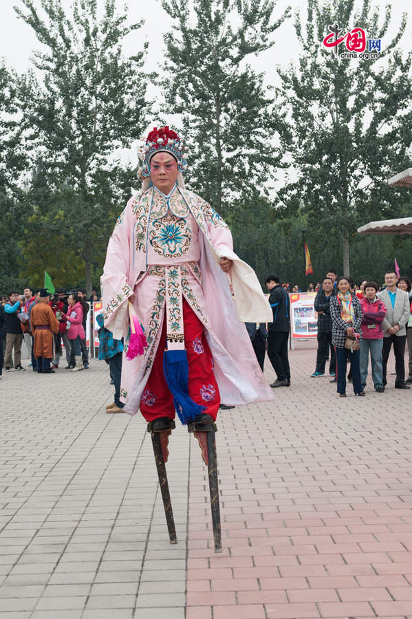 Chaoyang Park in the eastern downtown of Beijing, capital of China, stages grand commemorative activities on Wednesday, Oct. 1, 2014, to mark the 65th National Day holiday of the People&apos;s Republic of China, which was founded on Oct. 1, 1949. The celebrations at Chaoyang Park are in sync with similar activities in all of the around 300 parks in Beijing on this day. [Photo by Chen Boyuan / China.org.cn]