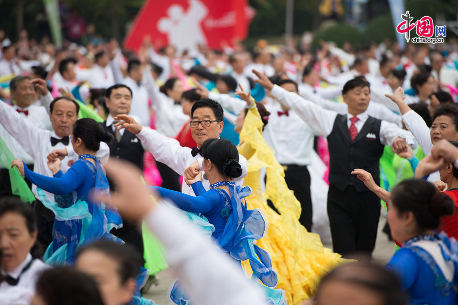 Chaoyang Park in the eastern downtown of Beijing, capital of China, stages grand commemorative activities on Wednesday, Oct. 1, 2014, to mark the 65th National Day holiday of the People&apos;s Republic of China, which was founded on Oct. 1, 1949. The celebrations at Chaoyang Park are in sync with similar activities in all of the around 300 parks in Beijing on this day. [Photo by Chen Boyuan / China.org.cn]