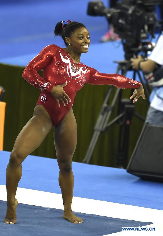 Simone Biles of the USA performs on the floor during the women&apos;s team final of the 45th Gymnastics World Championships in Nanning, capital of south China&apos;s Guangxi Zhuang Autonomous Region, Oct. 8, 2014. Team USA won the title with a total of 179.280 points.