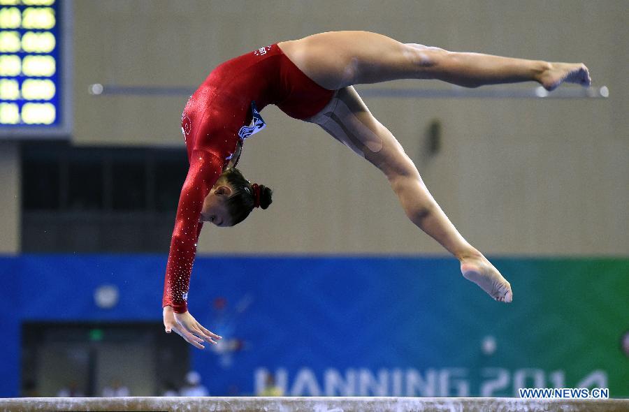Kyla Ross of the USA performs on the balance beam during the women&apos;s team final of the 45th Gymnastics World Championships in Nanning, capital of south China&apos;s Guangxi Zhuang Autonomous Region, Oct. 8, 2014. Team USA won the title with a total of 179.280 points
