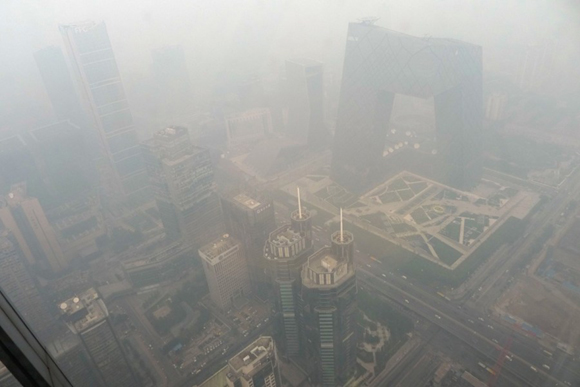 Beijing issued a yellow alert for air pollution on Wednesday with smog forecast to continue for the next three days.