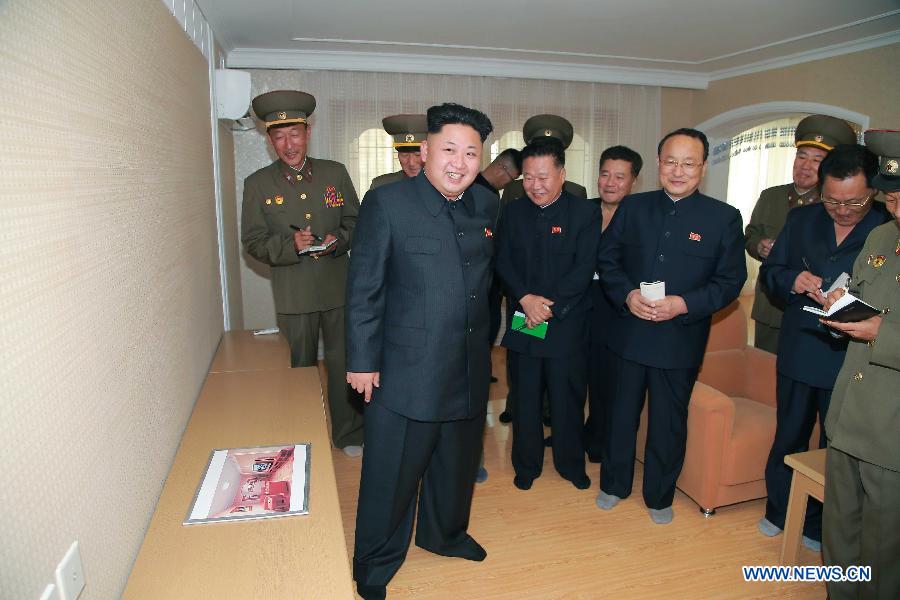 This undated photo provided by Korean Central News Agency (KCNA) shows top leader of the Democratic People&apos;s Republic of Korea (DPRK) Kim Jong Un (Front) giving field guidance to the completed apartment houses for educators of Kim Chaek University of Technology. 