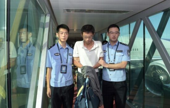 A fugitive is extradited by Chinese police.
