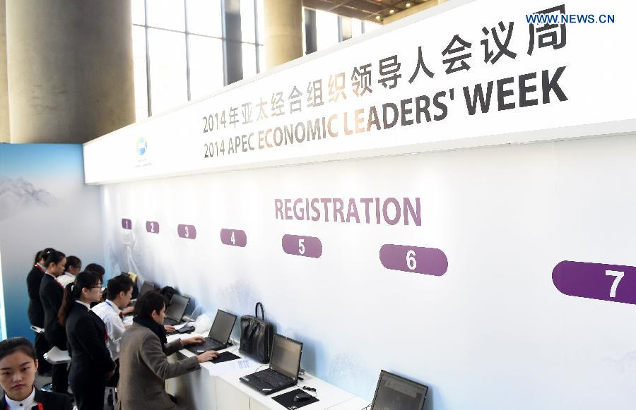 Participants use computers at the registration center for the 2014 APEC Economic Leaders' Week in Beijing, China, Nov. 3, 2014. The registration center for the APEC meeting in Beijing was officially opened on Monday, providing reception service running from 8:00 a.m. to 6:00 p.m. [Photo/Xinhua]