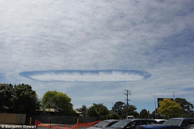 An amazing fallstreak hole appears over a town in Australia's Victoria State on Nov. 3. 