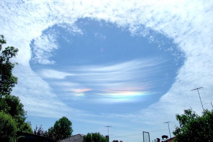 An amazing fallstreak hole appears over a town in Australia's Victoria State on Nov. 3. 