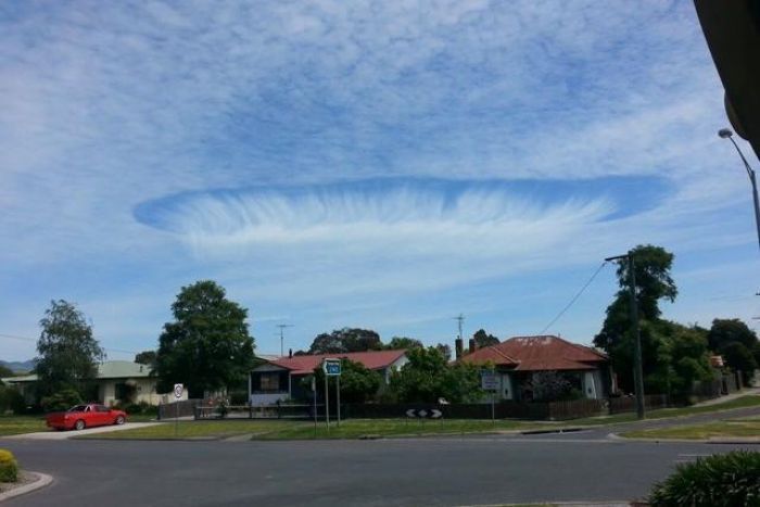 An amazing fallstreak hole appears over a town in Australia's Victoria State on Nov. 3. 