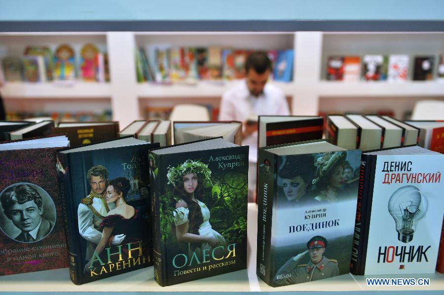 A guest visits Russian publisher booth in the 33rd International Istanbul Book Fair in Istanbul, Turkey on Nov. 8, 2014.