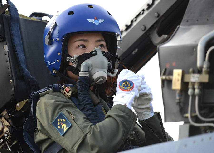 Yu Xu, a member of China's Bayi Aerobatic Team prepares for an aerial performance at the 10th China International Aviation and Aerospace Exhibition in Zhuhai, South China's Guangdong province on Nov 11, 2014. [Photo/Xinhua] 