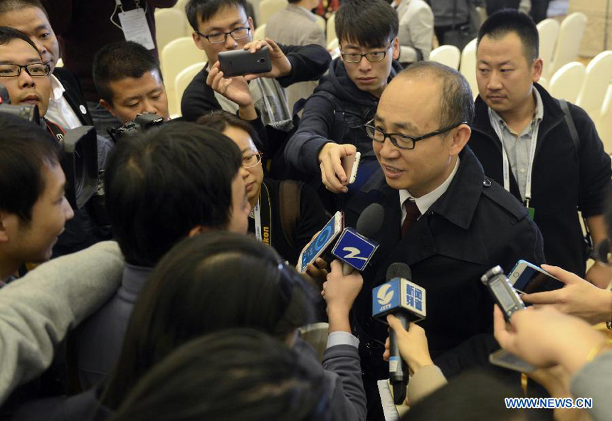 Pan Shiyi, chairman of real estate developer SOHO China, receives interview at the closing ceremony of the World Internet Conference in Wuzhen, east China's Zhejiang Province, Nov. 21, 2014. The three-day conference concluded here on Friday. [Photo/Xinhua]