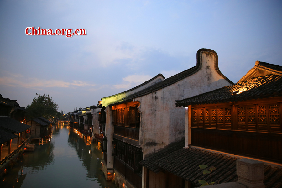 Wuzhen is a historic scenic town, part of Tongxiang, located in northern China's Zhejiang Province. The canals of Wuzhen have led to it being nicknamed the 'Venice of the East.' The picture shows the night view of Wuzhen. [Photo/China.org.cn by He Shan]