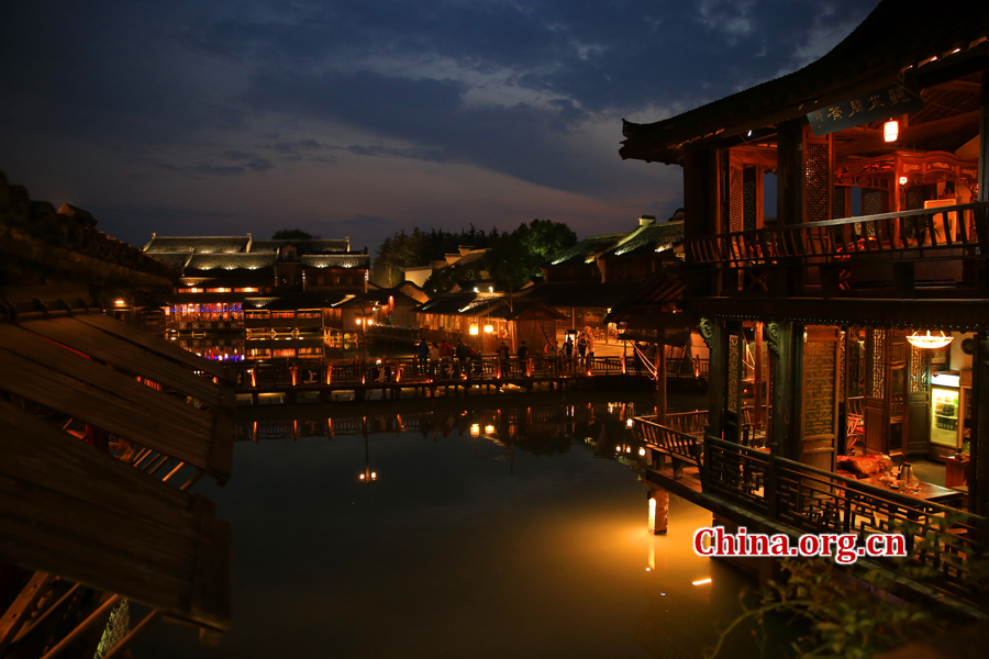 Wuzhen is a historic scenic town, part of Tongxiang, located in northern China's Zhejiang Province. The canals of Wuzhen have led to it being nicknamed the 'Venice of the East.' The picture shows the night view of Wuzhen. [Photo/China.org.cn by He Shan] 