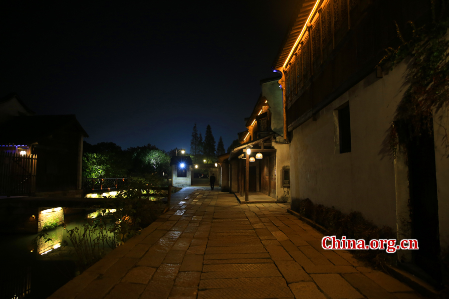 Wuzhen is a historic scenic town, part of Tongxiang, located in northern China's Zhejiang Province. The canals of Wuzhen have led to it being nicknamed the 'Venice of the East.' The picture shows the night view of Wuzhen. [Photo/China.org.cn by He Shan] 