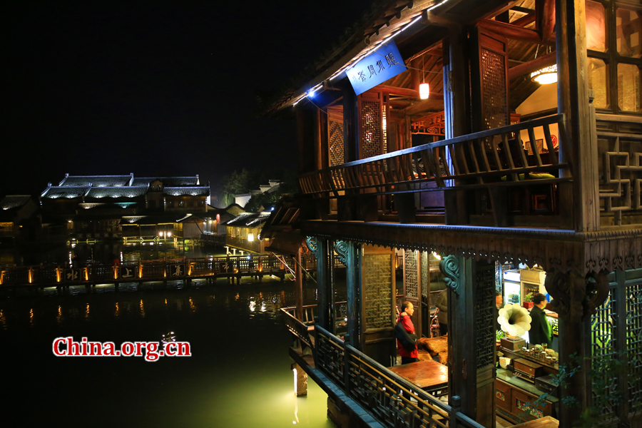 Wuzhen is a historic scenic town, part of Tongxiang, located in northern China's Zhejiang Province. The canals of Wuzhen have led to it being nicknamed the 'Venice of the East.' The picture shows the night view of Wuzhen. [Photo/China.org.cn by He Shan]