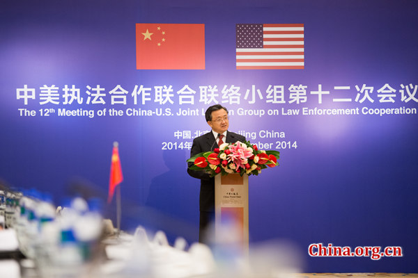 Liu Zhenmin, deputy foreign minister of China delivers a keynote speech at the opening ceremony of the 12th Meeting of the China-U.S. Joint Liaison Group on Law Enforcement Cooperation on Wednesday, Dec. 3, 2014 in Beijing, China. [Photo by Chen Boyuan / China.org.cn]