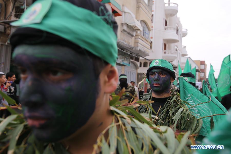 Palestinian militants attend a rally ahead of the 27th founding anniversary of Hamas, in the southern Gaza Strip city of Rafah, on December 12, 2014.