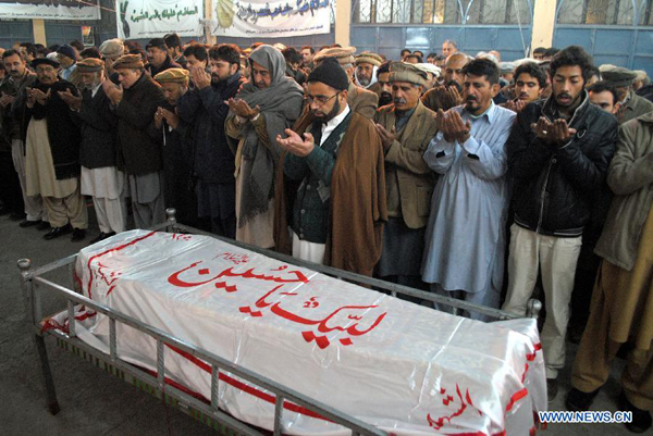 Mourners attend the funeral of a student who was killed in an attack by militants on an army-run school in northwest Pakistan's Peshawar on Dec. 16, 2014. A total of 141 people including 132 students and nine staff members were killed and 133 others injured in Tuesday's terror attack at an army-run public school in Pakistan's northwest city of Peshawar, said a spokesman of the Pakistani army. [Photo/Xinhua]