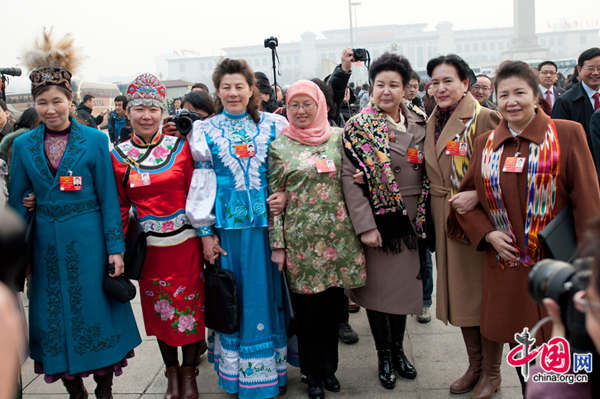 Delegates who are from China's ethnic groups to the National People's Congress pose for photo before the Great Hall of the People on March 5, 2012. [File photo by Chen Boyuan / China.org.cn]