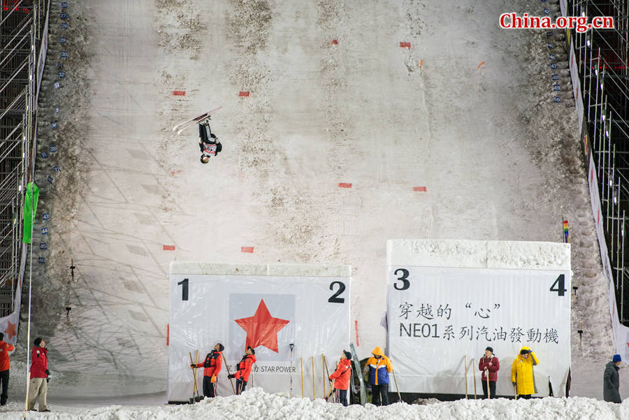 A contestant competing in the FIS Freestyle Ski Aerials World Cup held at the Bird&apos;s Nest Staidum in Beijing, China on Satuday, Dec. 20, 2014. [Photo by Chen Boyuan / China.org.cn]