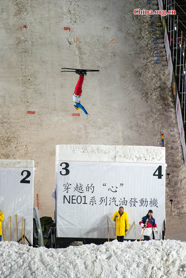 A contestant competing in the FIS Freestyle Ski Aerials World Cup held at the Bird&apos;s Nest Staidum in Beijing, China on Satuday, Dec. 20, 2014. [Photo by Chen Boyuan / China.org.cn]