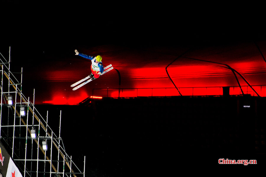 A contestant competing in the FIS Freestyle Ski Aerials World Cup held at the Bird&apos;s Nest Staidum in Beijing, China on Satuday, Dec. 20, 2014. [Photo by Chen Boyuan / China.org.cn]