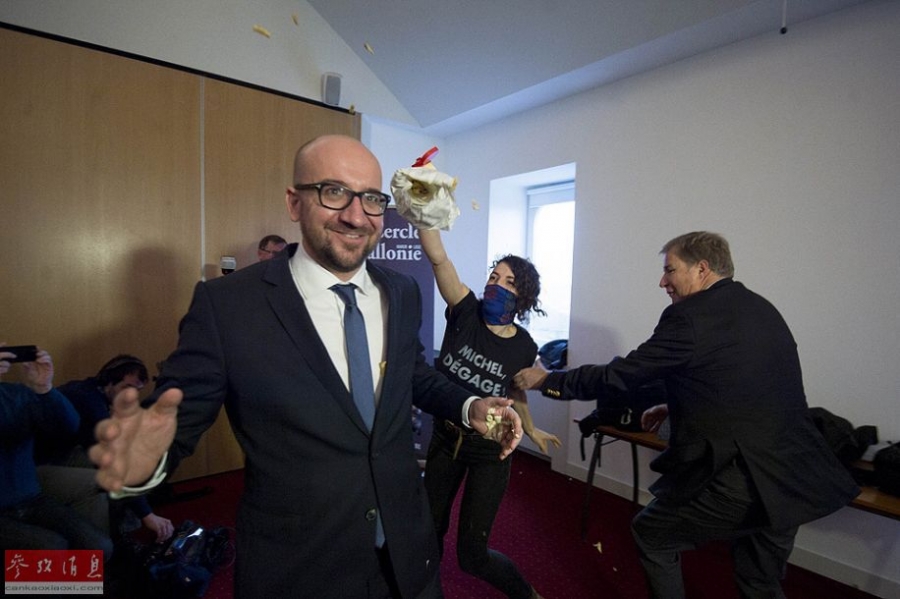 Feminists throw fries, mayo at the Belgian prime minister, Charles Michel, at a conference in Namur on Monday. [Photo/cankaoxiaoxi]