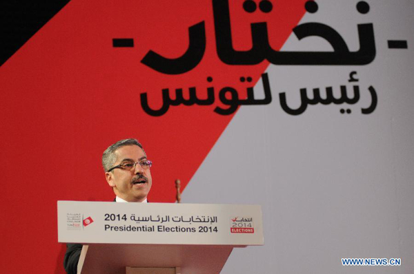 Chafik Sarsar, head of the Independent Election Commission (ISIE), addresses a press conference in Tunis, capital of Tunisia, Dec. 22, 2014. The Nidaa Tounes candidate Beji Caid Essebsi won the second round of Tunisia's 2014 presidential elections with 55.68 percent of the votes, the Tunisian Elections Board (ISIE) announced on Monday.