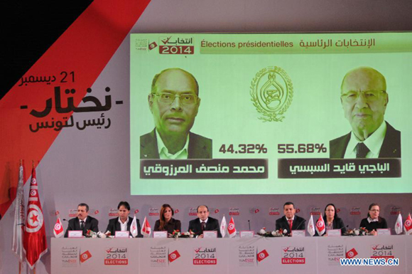 Members of the Independent Election Commission (ISIE) attend a press conference in Tunis, capital of Tunisia, Dec. 22, 2014. The Nidaa Tounes candidate Beji Caid Essebsi won the second round of Tunisia's 2014 presidential elections with 55.68 percent of the votes, the Tunisian Elections Board (ISIE) announced on Monday.