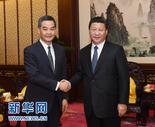 Chinese President Xi Jinping (R) meets with Hong Kong Special Administrative Region Chief Executive Leung Chun-ying in Beijing, capital of China, Dec. 26, 2014. Leung is in Beijing to report his work to the central government. (Xinhua/Rao Aimin)