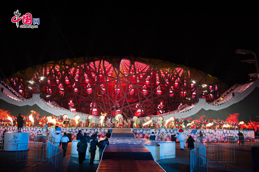 The New Year celebration 'Countdown to 2015' holds its last rehearsal at Beijing's Olympic Park, where the national symbols of the Bird's Nest stadium and the Water Cube National Aquatics Center are located, on Tuesday, Dec. 30, 2014. The ceremony also features the Chinese capital's bidding for the 2022 Winter Olympics. [Photo by Chen Boyuan / China.org.cn]