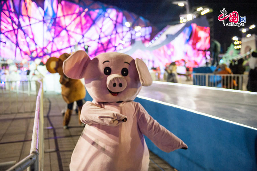 The New Year celebration 'Countdown to 2015' holds its last rehearsal at Beijing's Olympic Park, where the national symbols of the Bird's Nest stadium and the Water Cube National Aquatics Center are located, on Tuesday, Dec. 30, 2014. The ceremony also features the Chinese capital's bidding for the 2022 Winter Olympics. [Photo by Chen Boyuan / China.org.cn]