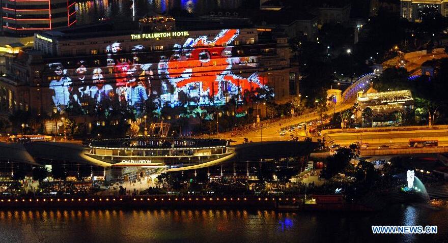 Photo taken on Dec. 31, 2014 shows a panoramic view of the New Year Count Down party in Singapore's Marina Bay area. Singapore celebrates the crossing over to the new year on Wednesday, and the 50th anniversary of independence will be marked in 2015. (Xinhua/Then Chih Wey)