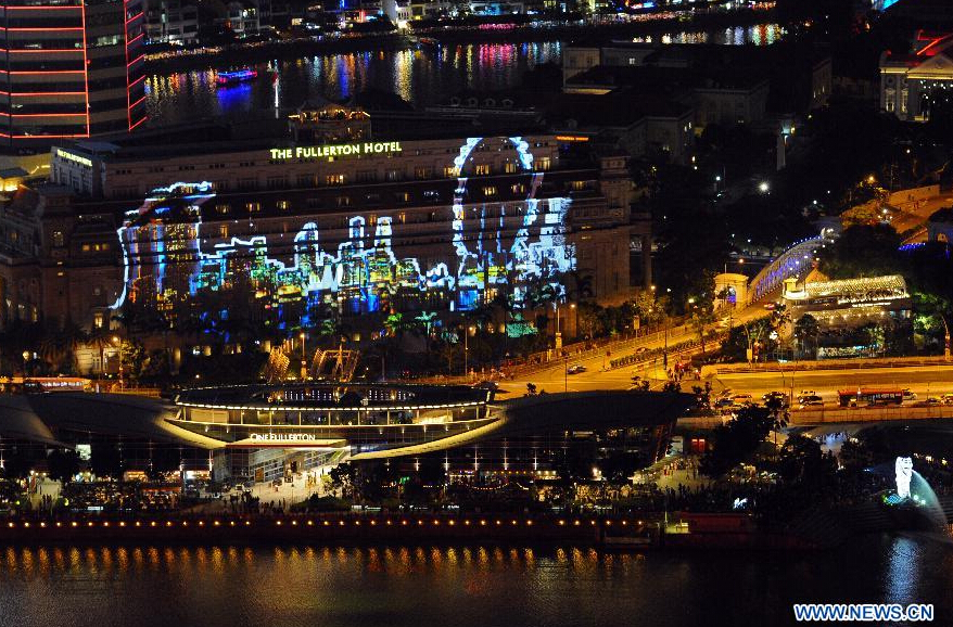 Photo taken on Dec. 31, 2014 shows a panoramic view of the New Year Count Down party in Singapore's Marina Bay area. Singapore celebrates the crossing over to the new year on Wednesday, and the 50th anniversary of independence will be marked in 2015. (Xinhua/Then Chih Wey)