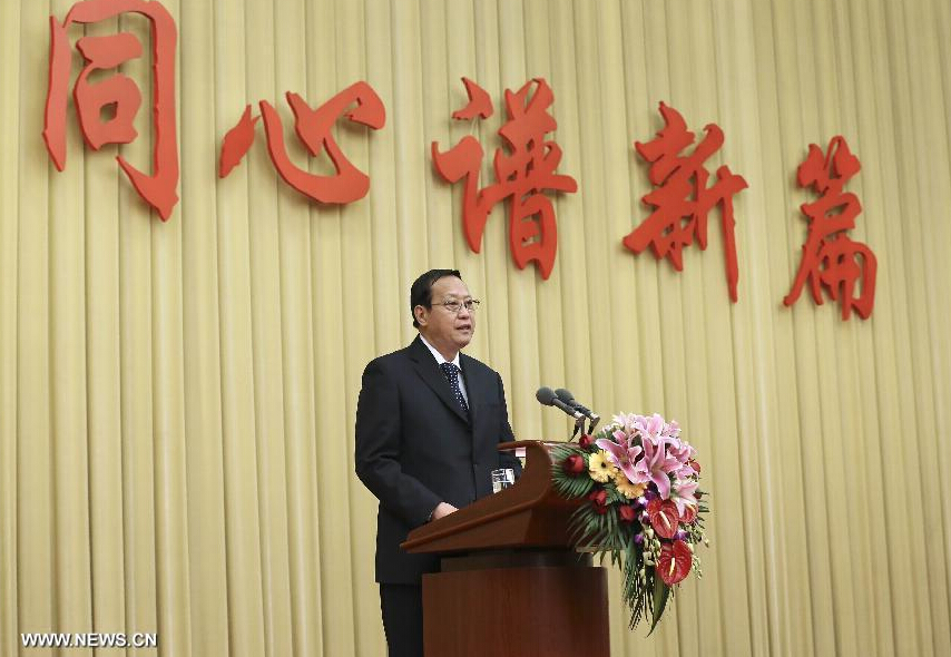 Zhang Baowen, chairman of the Central Committee of the China Democratic League, speaks at a new year celebration tea party hosted by the National Committee of the Chinese People's Political Consultative Conference (CPPCC) in Beijing, capital of China, Dec. 31, 2014. (Xinhua/Pang Xinglei)