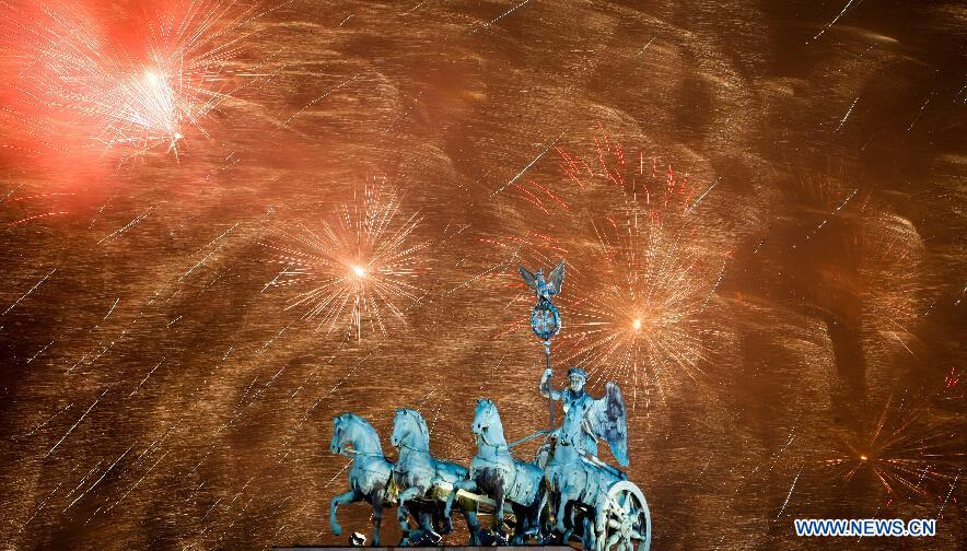 Fireworks light the sky over Brandenburg Gate during the celebration for the New Year in Berlin, Germany on Jan. 1, 2015. (Xinhua/Zhang Fan)