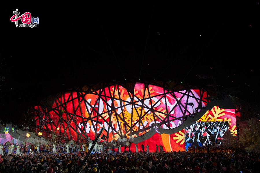 Beijing puts an a grand New Year ceremony &apos;Countdown to 2015&apos; on the night of Dec. 31, 2014 at the Olympic Park, the place that hosts the National Stadium &apos;the Bird&apos;s Nest&apos; and the National Aquatics Center &apos;the Water Cube.&apos; The New Year celebration is also a warm-up of the city&apos;s bidding of the 2022 Winter Olympic Games. [Photo by Chen Boyuan / China.org.cn]