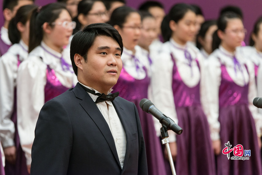 Choir of Tianjin Nankai High School perform singing at the launch of the English-edition &apos;Early Writings of Zhou Enlai&apos; on Thursday, Jan. 8, 2015 at the Great Hall of the People in Beijing. [Photo by Chen Boyuan / China.org.cn]