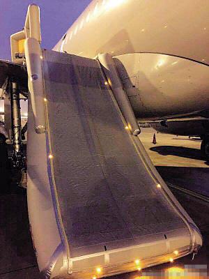 The slide was triggered after a passenger opened the emergency exit at Chongqing Jiangbei Airport in Southwest China, Monday. [Photo/weibo.com/carnoc]
