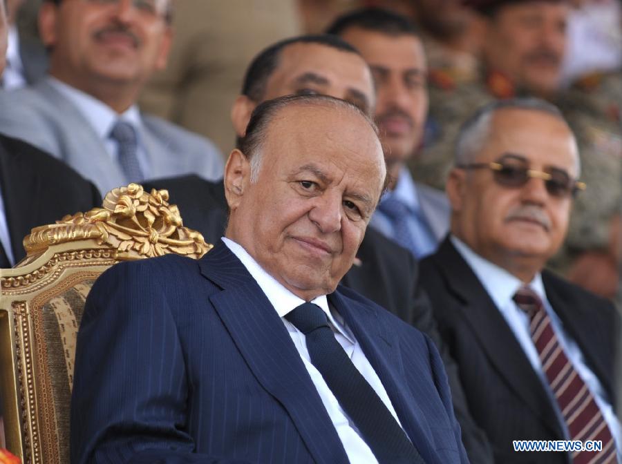 The file photo taken on May 22, 2012 shows Yemeni President Abd-Rabbu Mansour Hadi attending the military parade for the 22nd anniversary of the national day of unification in Sanaa, Yemen. Yemeni President Abd-Rabbu Mansour Hadi on Thursday night submitted his resignation to the parliament amid standoff with the Shiite Houthi group who control the capital. The Yemeni parliament on Thursday night rejected Hadi's resignation and called for holding an emergency session on Friday to resolve the crisis.