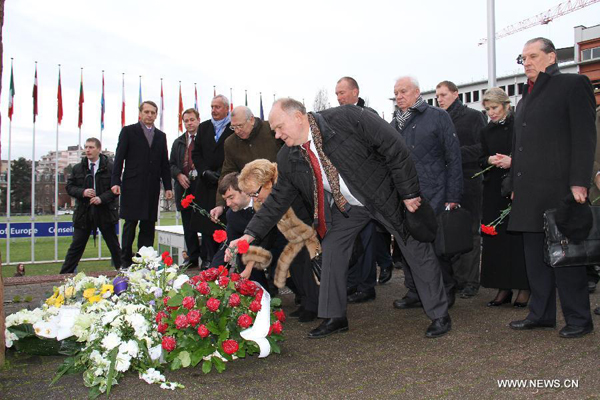 Russian Communist Party leader Gennady Zyuganov (1st R, front) pays tribute to a commemorative stone for Holocaust victims at the Council of Europe in Strasbourg, France, Jan. 27, 2015. Participants of the Parliamentary Assembly of the Council of Europe attended a commemoration of the 70th anniversary of the liberation of the Nazi German concentration and extermination camp in Auschwitz-Birkenau on Jan. 27, the International Holocaust Remembrance Day. [Photo/Xinhua]