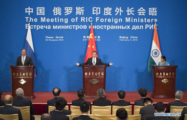 Chinese Foreign Minister Wang Yi (C), Russian Foreign Minister Sergey Lavrov (L) and Indian Foreign Minister Sushma Swaraj meet with the press after the 13th Meeting of Russian, Indian and Chinese (RIC) Foreign Ministers in Beijing, capital of China, Feb. 2, 2015. 