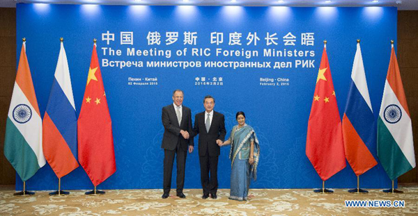 Chinese Foreign Minister Wang Yi (C), Russian Foreign Minister Sergey Lavrov (L) and Indian Foreign Minister Sushma Swaraj attend the 13th Meeting of Russian, Indian and Chinese (RIC) Foreign Ministers in Beijing, capital of China, Feb. 2, 2015. [Photo/Xinhua]