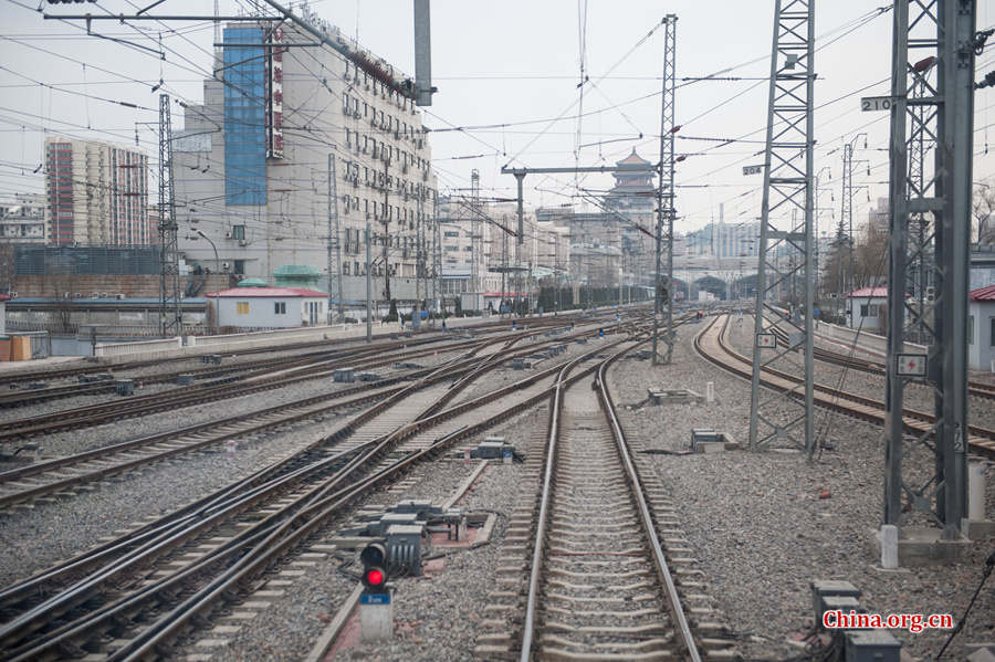 Song Jian and Ding Hailong have long been familiar with such seemingly complex railway turnouts. Song says that by looking at them almost every day, he can instantly tell whether they are in the right position. [Photo by Chen Boyuan / China.org.cn]