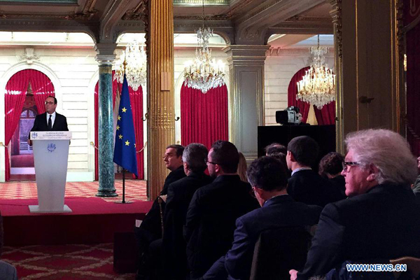 French President Francois Hollande (L) speaks during a press conference at the Elysee Palace in Paris, France, Feb. 5, 2015. French President Francois Hollande and German Chancellor Angela Merkel are due in Kiev in a new attempt to resolve peacefully the Ukrainian crisis amid rising tensions in the region, Hollande told reporters on Thursday. [Photo/Xinhua] 